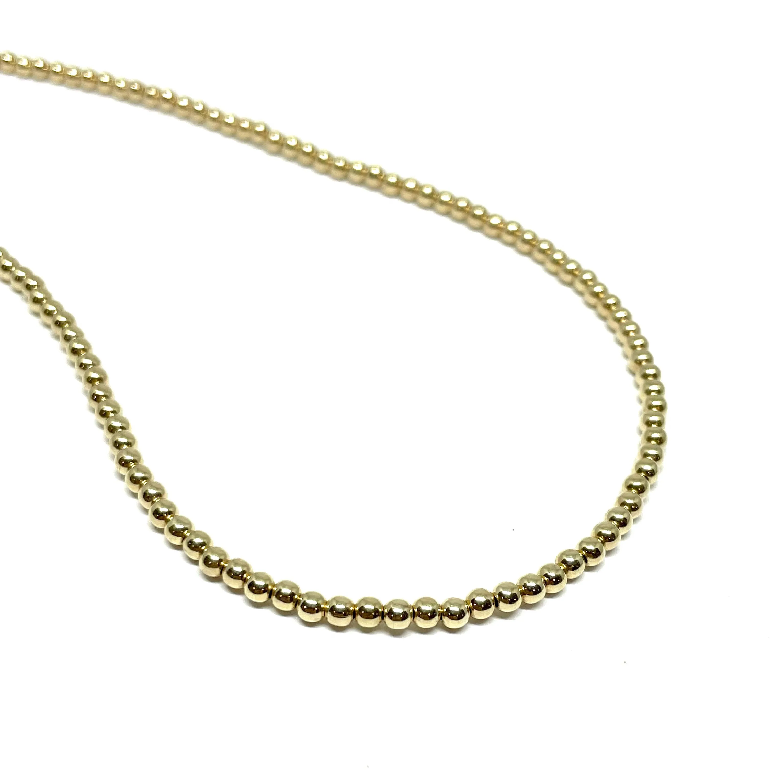 The “Aurora 3mm Gold Ball Necklace