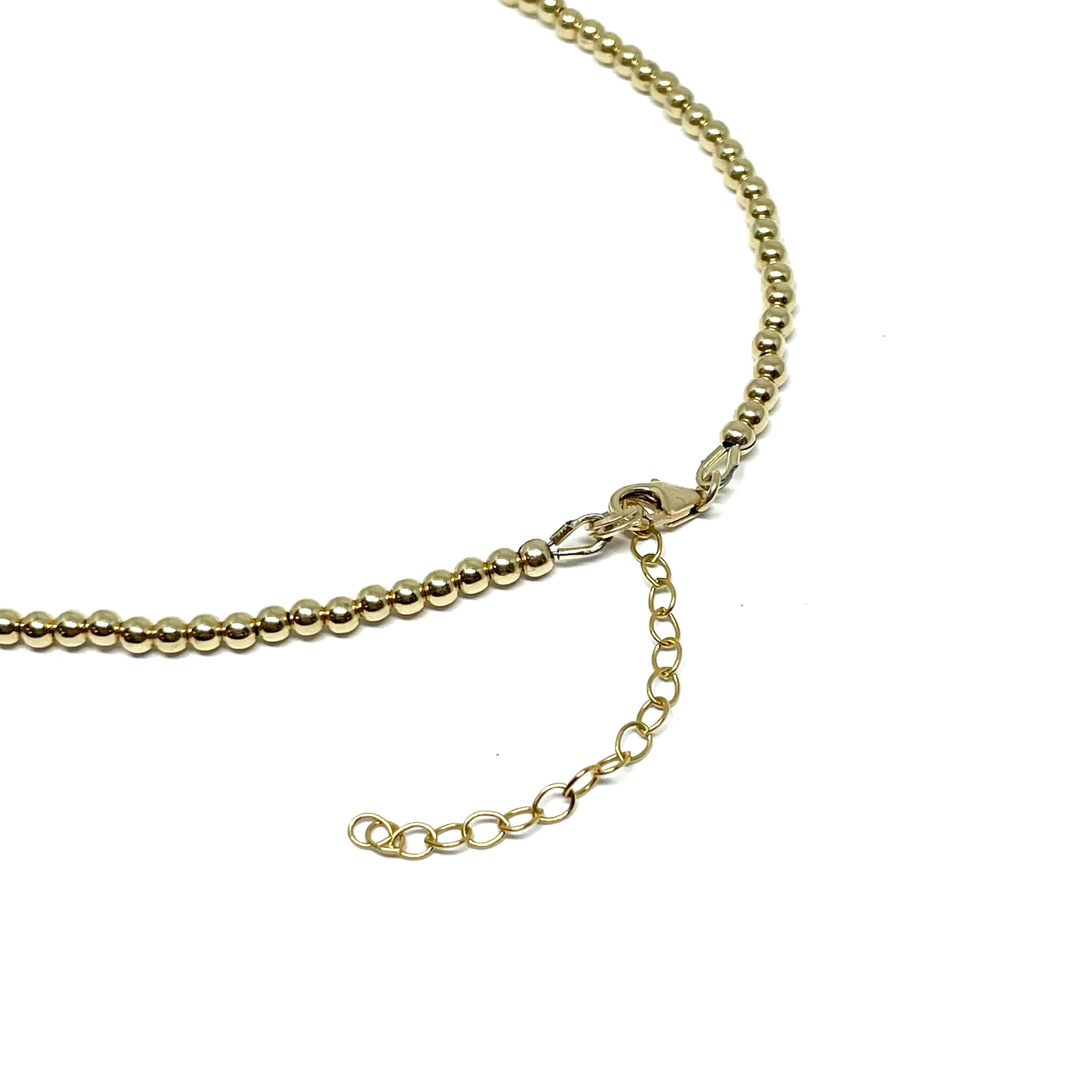 The “Aurora 3mm Gold Ball Necklace